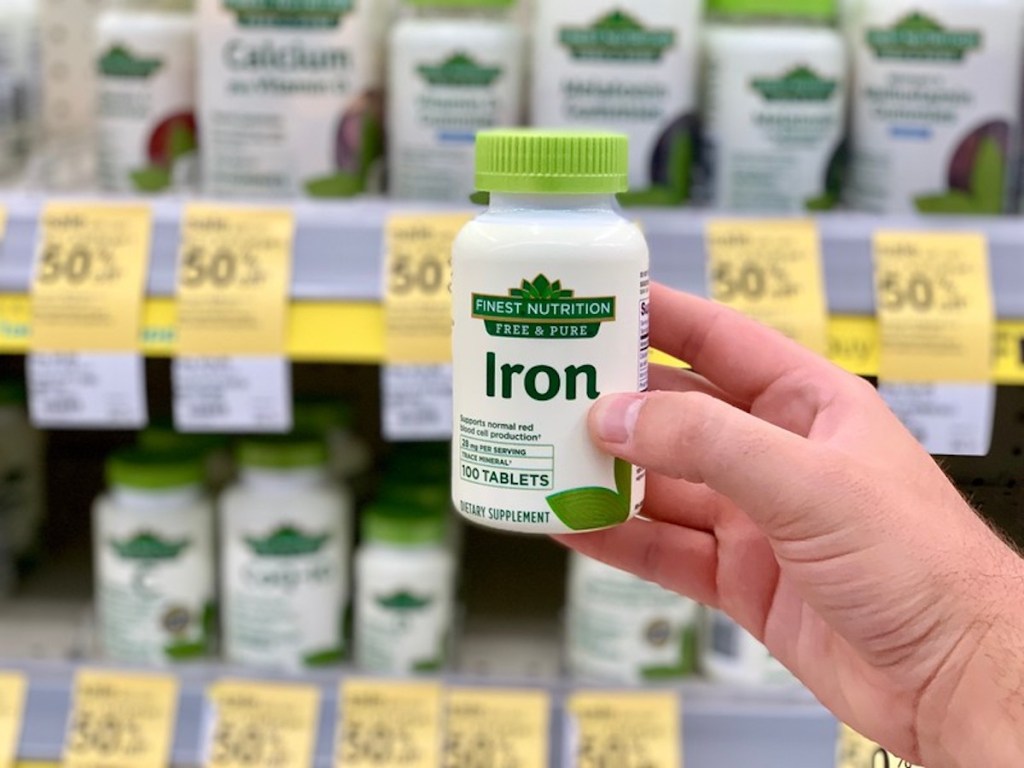 hand holding Finest Nutrition Free & Pure Iron