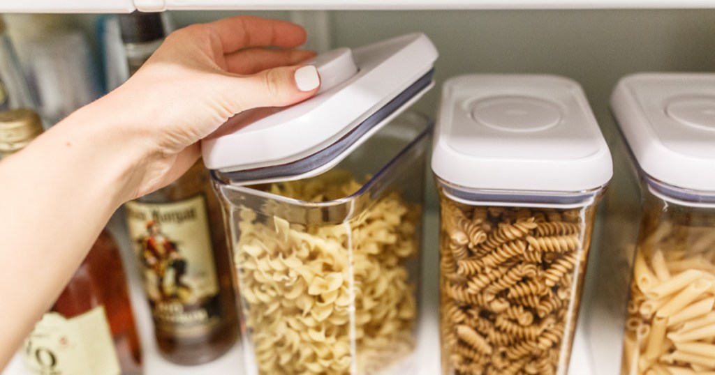 woman opening food storage container