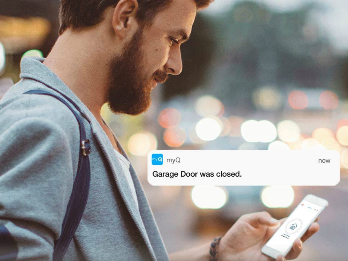 man checking garage door opener app
