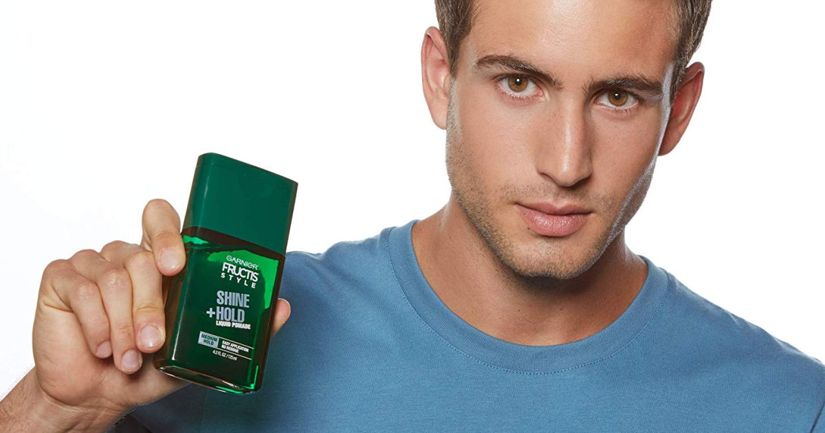 man holding Garnier Liquid Style Pomade Mask shine and hold