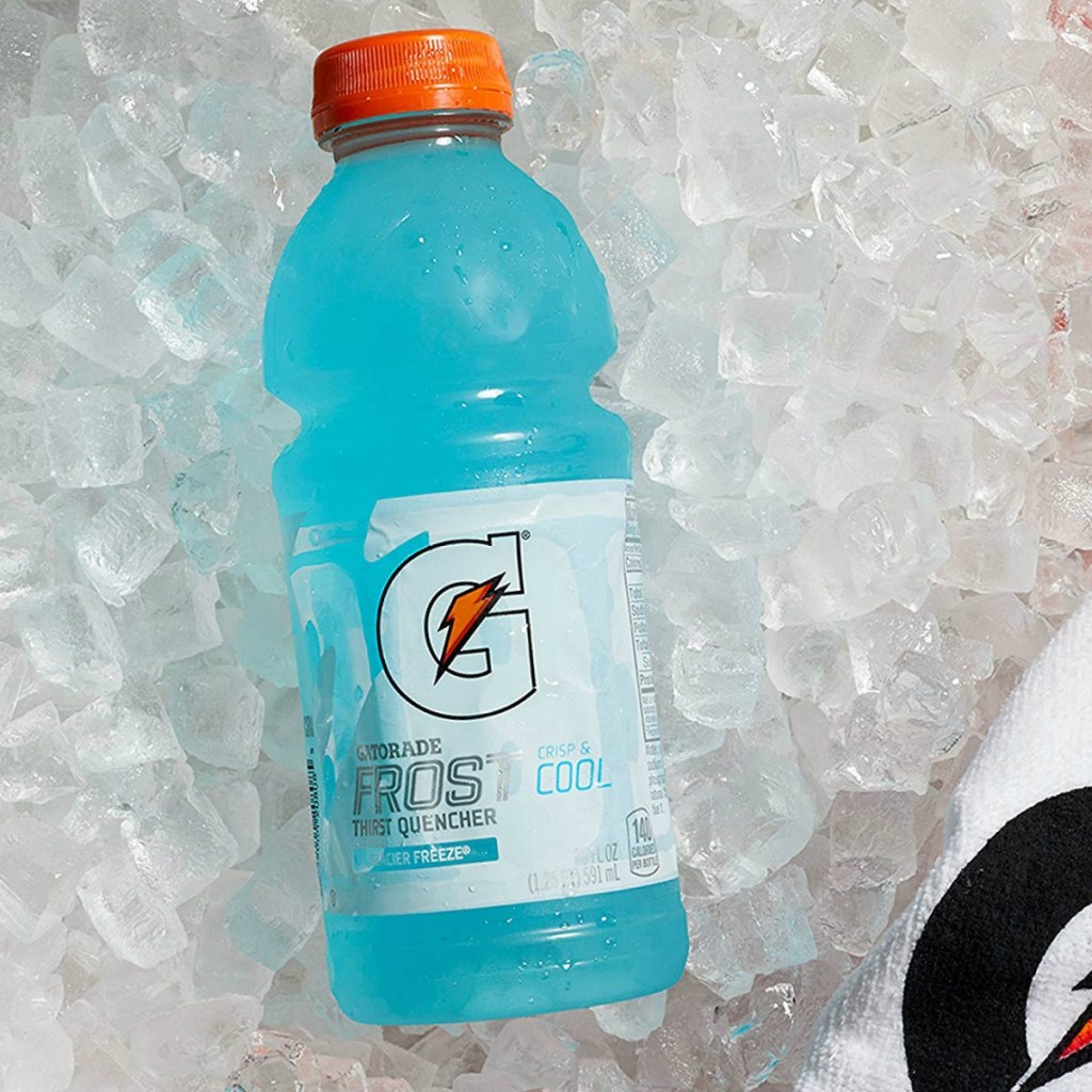 Single bottle of Gatorade on a pile of ice with a towel