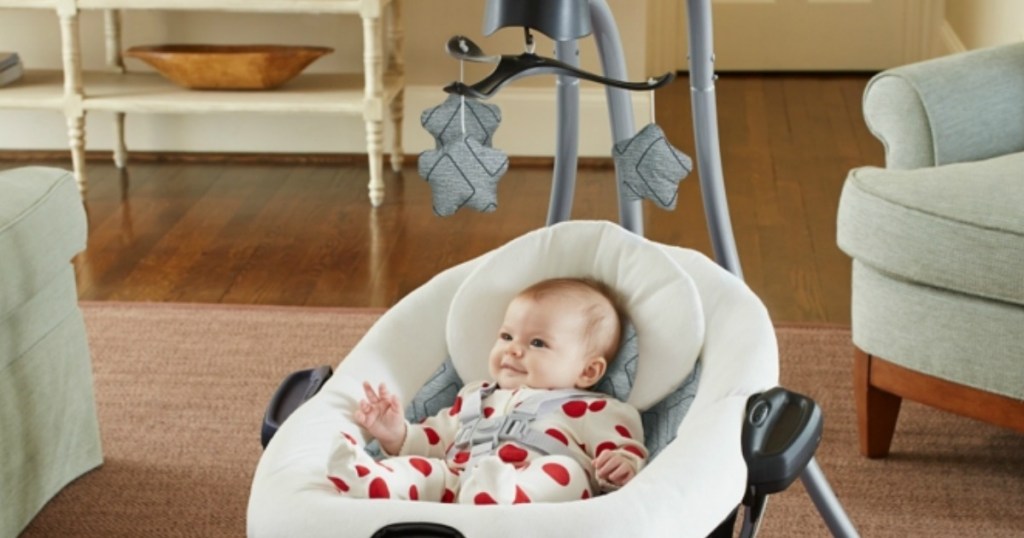 baby sitting in a baby swing