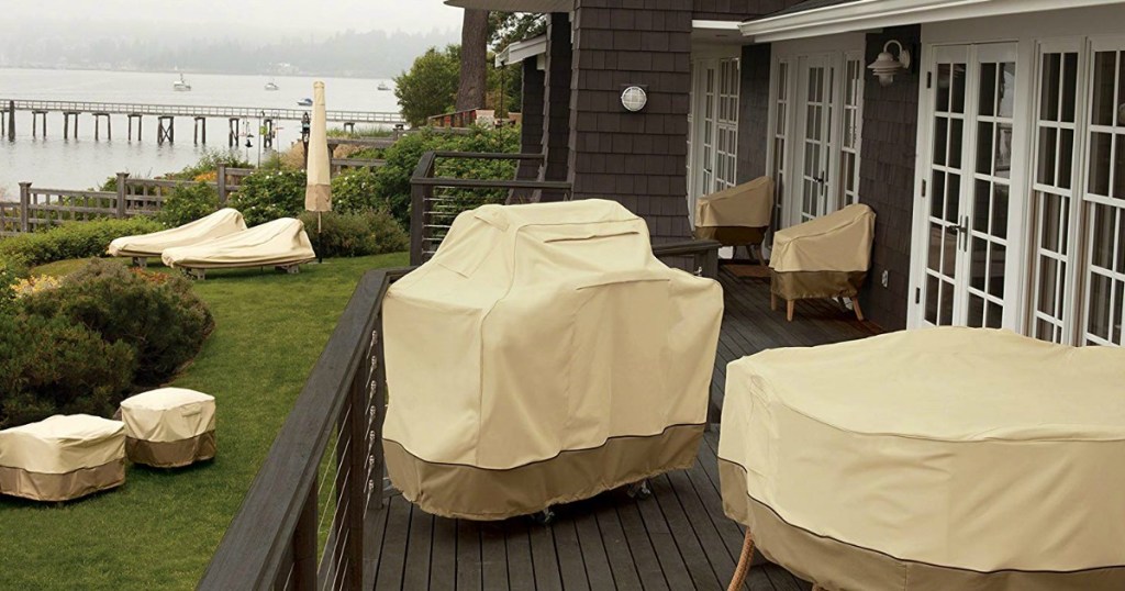 patio with covered furniture and grill