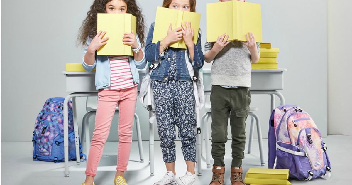 Kids at school standing next to High Sierra Backpacks