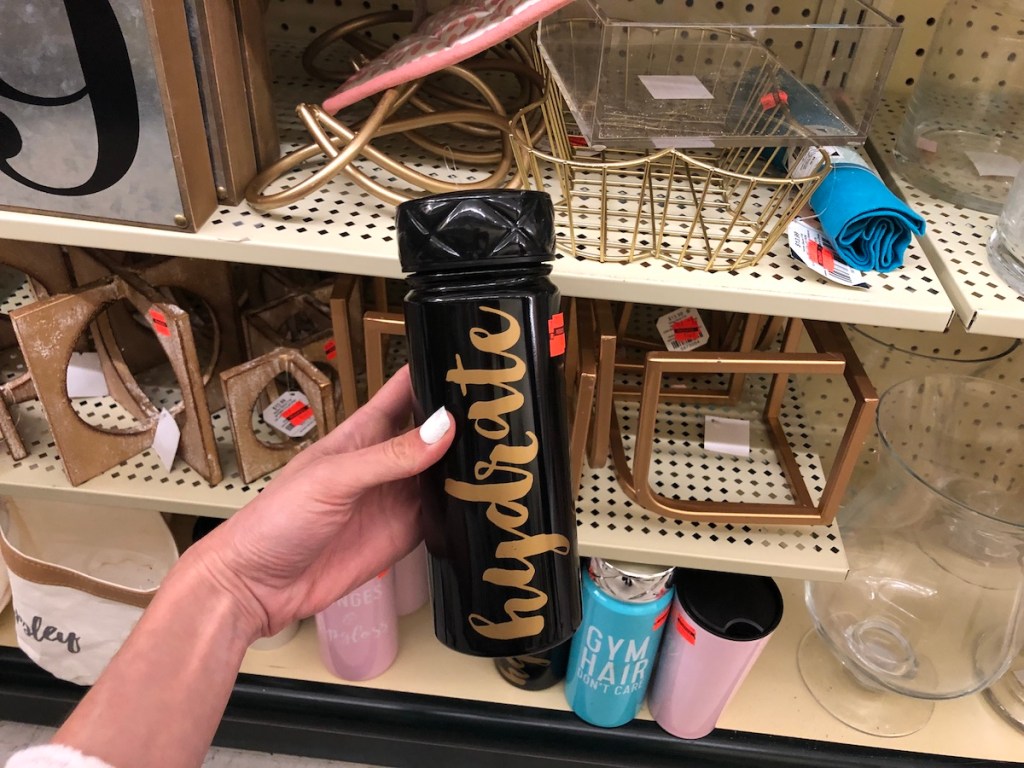 hand holding black hydrate bottle