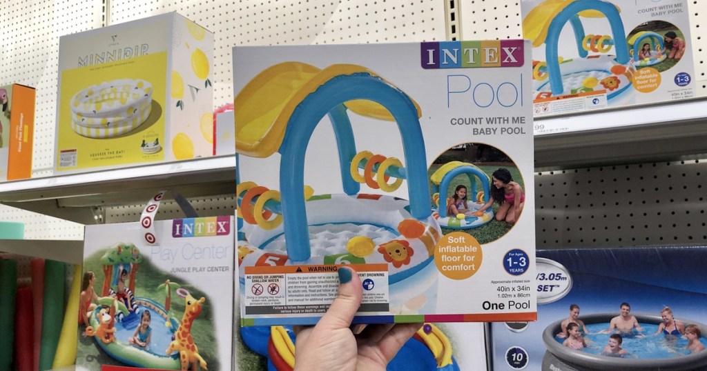 woman holding intex baby pool at target