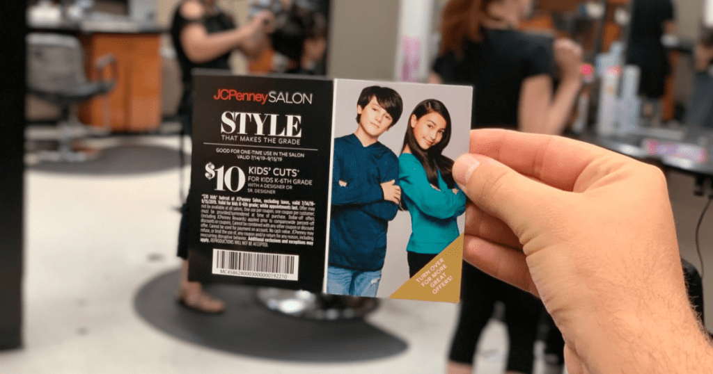 JCPenny Salon Kids' Haircut Coupon in hand with salon in background