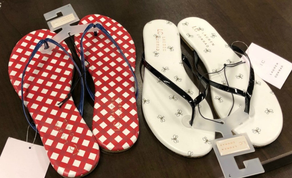 Two pairs of printed women's flip flops in store