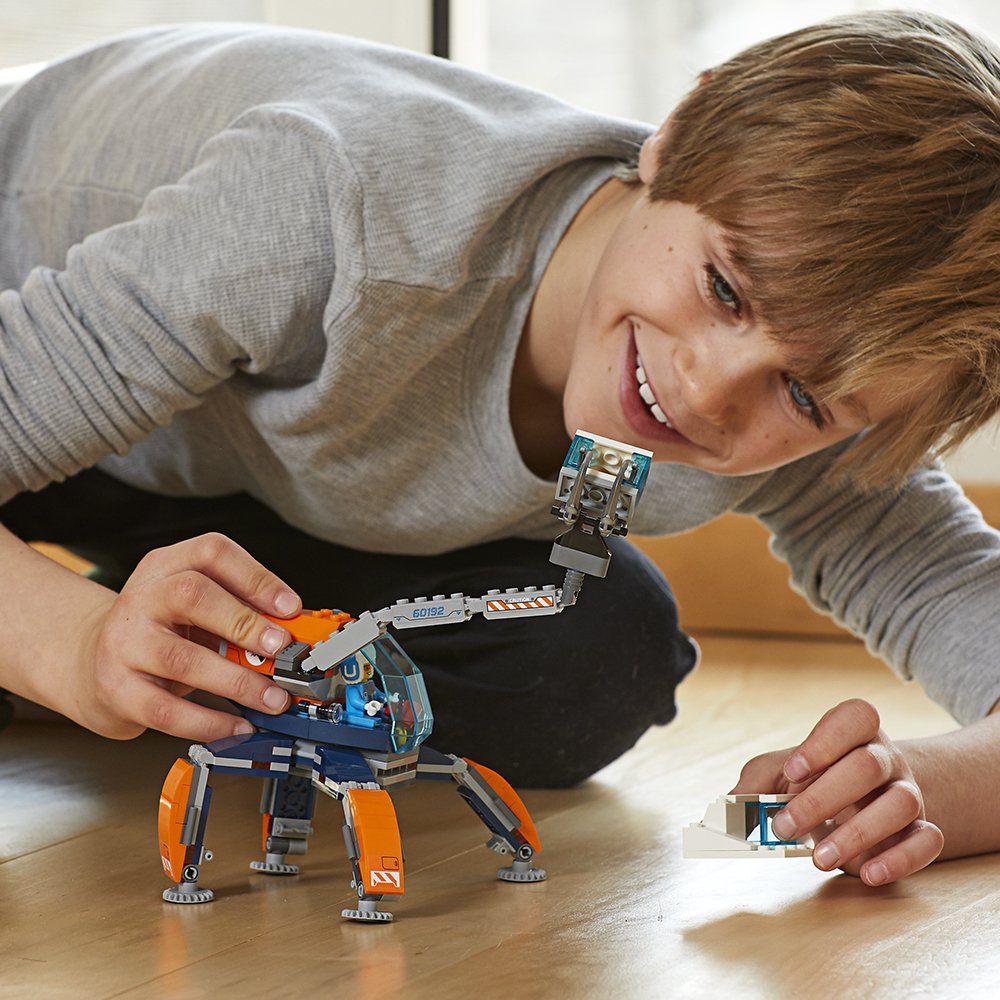 boy playing with LEGO Crawler