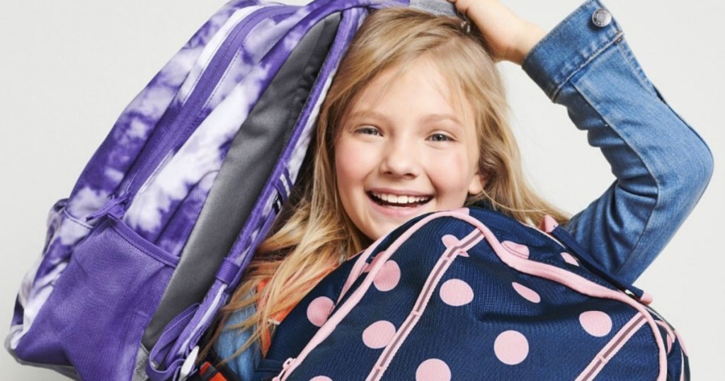 Girl holding two Lands' End large backpacks