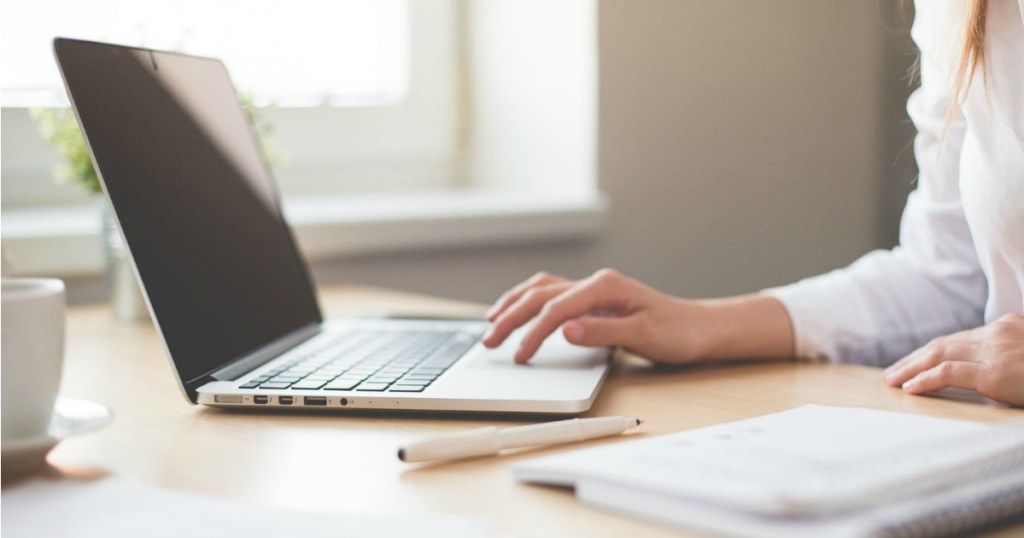 Woman using laptop on desk