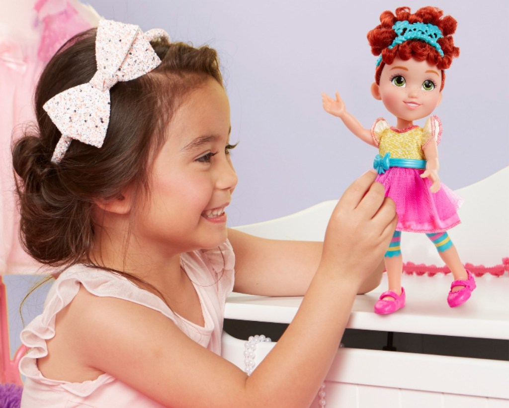 girl playing with Fancy Nancy Classique Doll