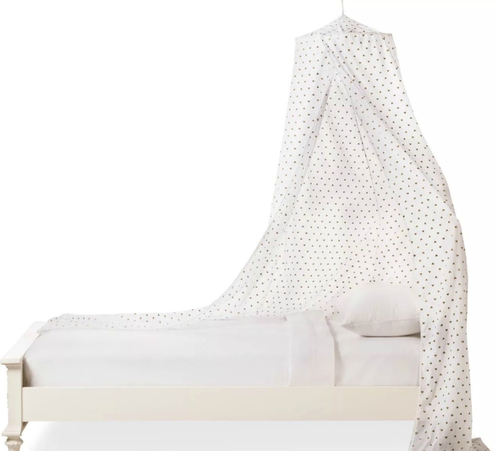 White heart print bed canopy on twin size bed