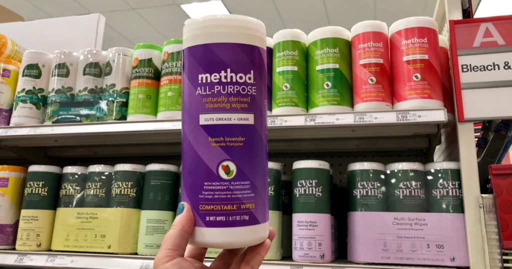 woman holding canister of lavender all purpose wipes at target