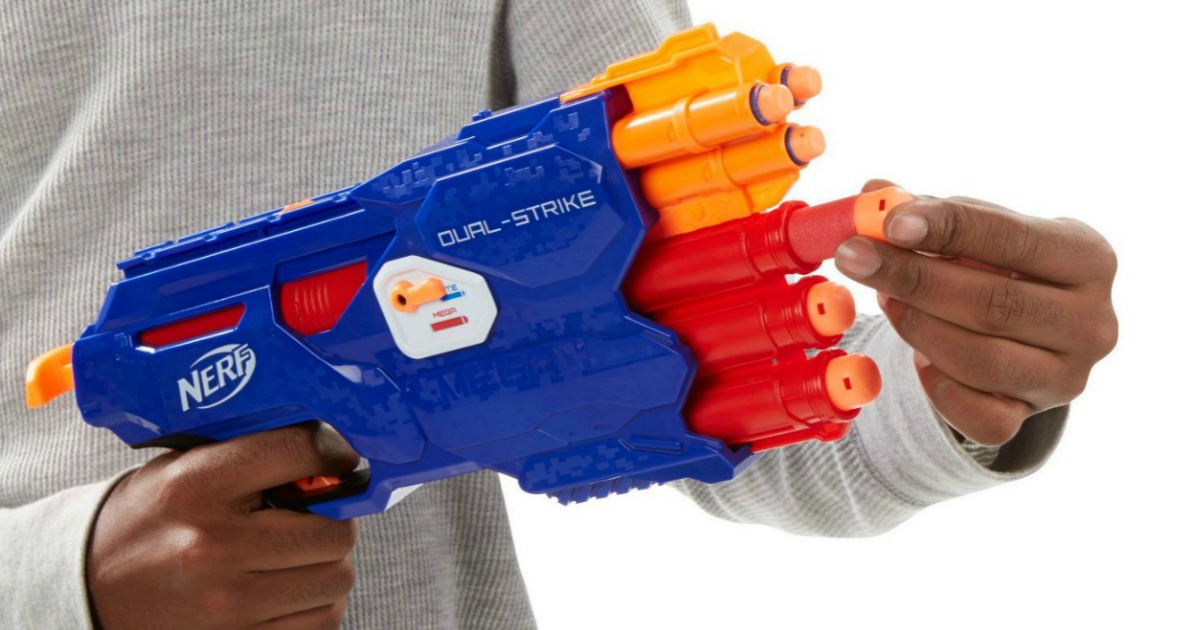 boy loading dart into NERF Dual-Strike blaster gun