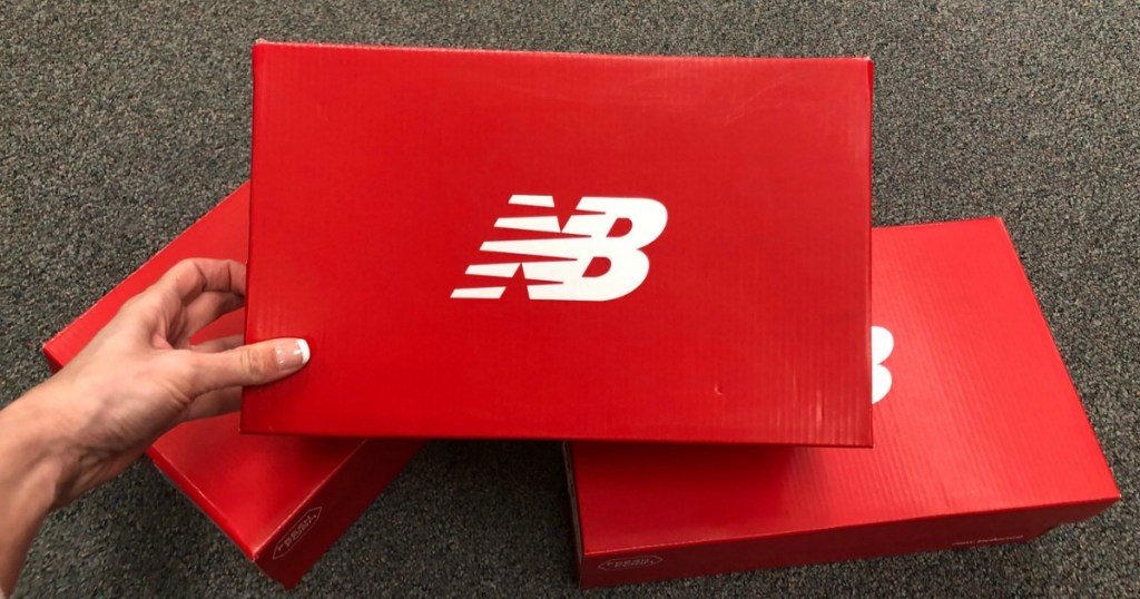 Stack of three New Balance shoe boxes