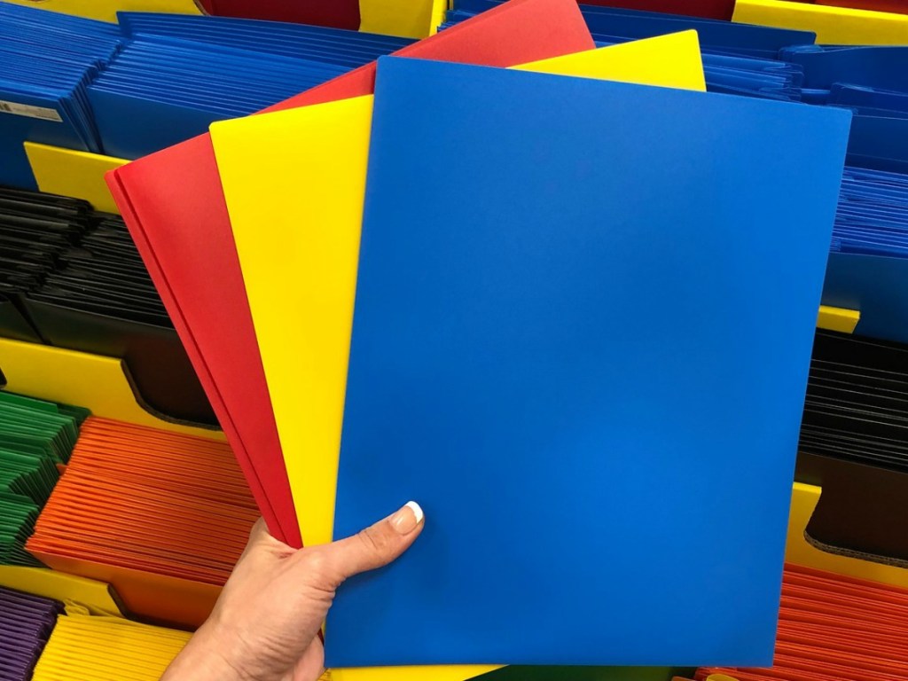 colorful Poly Folders fanned open in hand at Office Depot