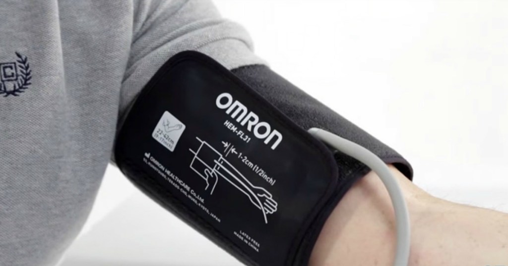Omron blood pressure monitor on a mans arm