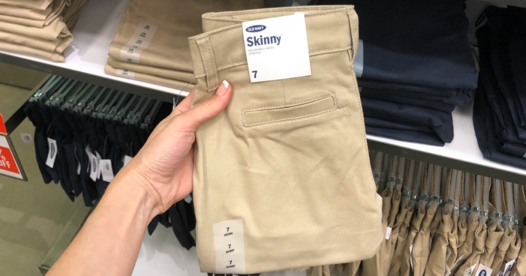 Old Uniform Pants being held by a woman's hand