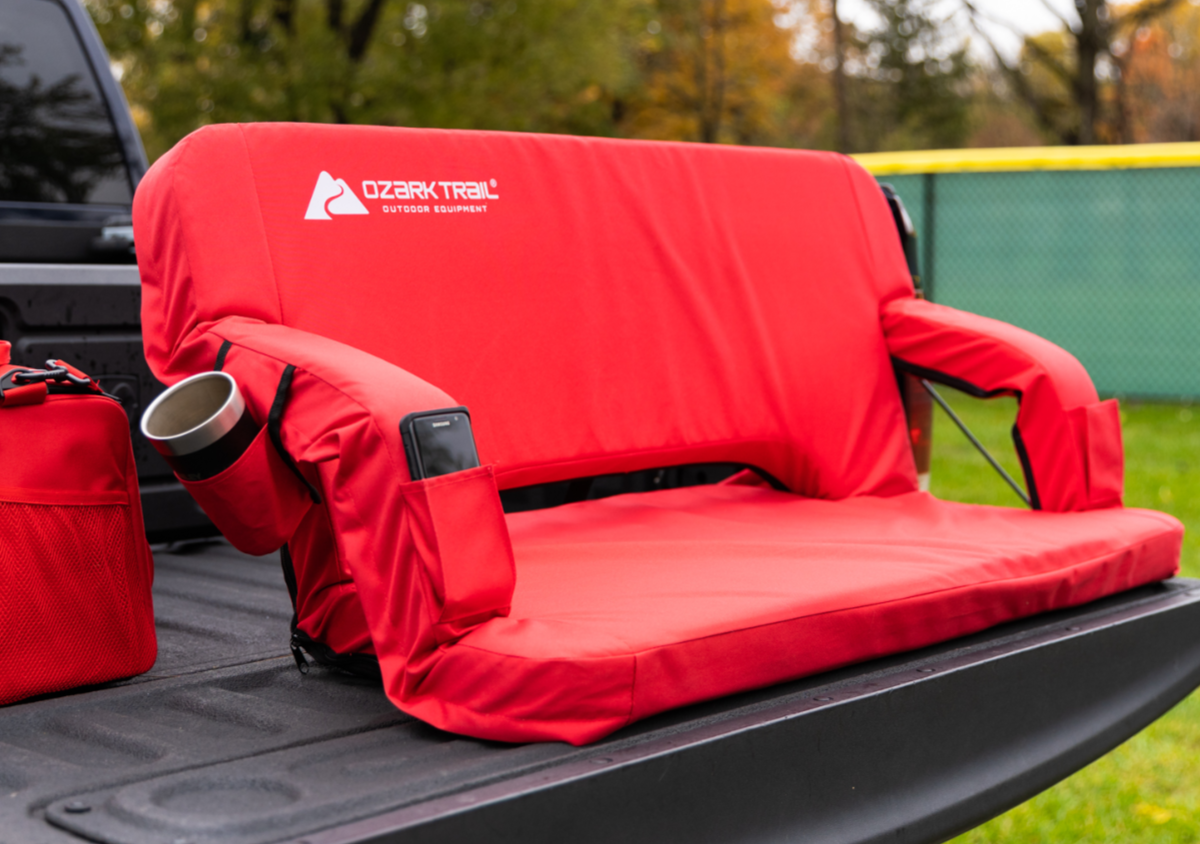 Ozark Trail Adjustable Tailgate Padded Couch sitting on tailgate of truck