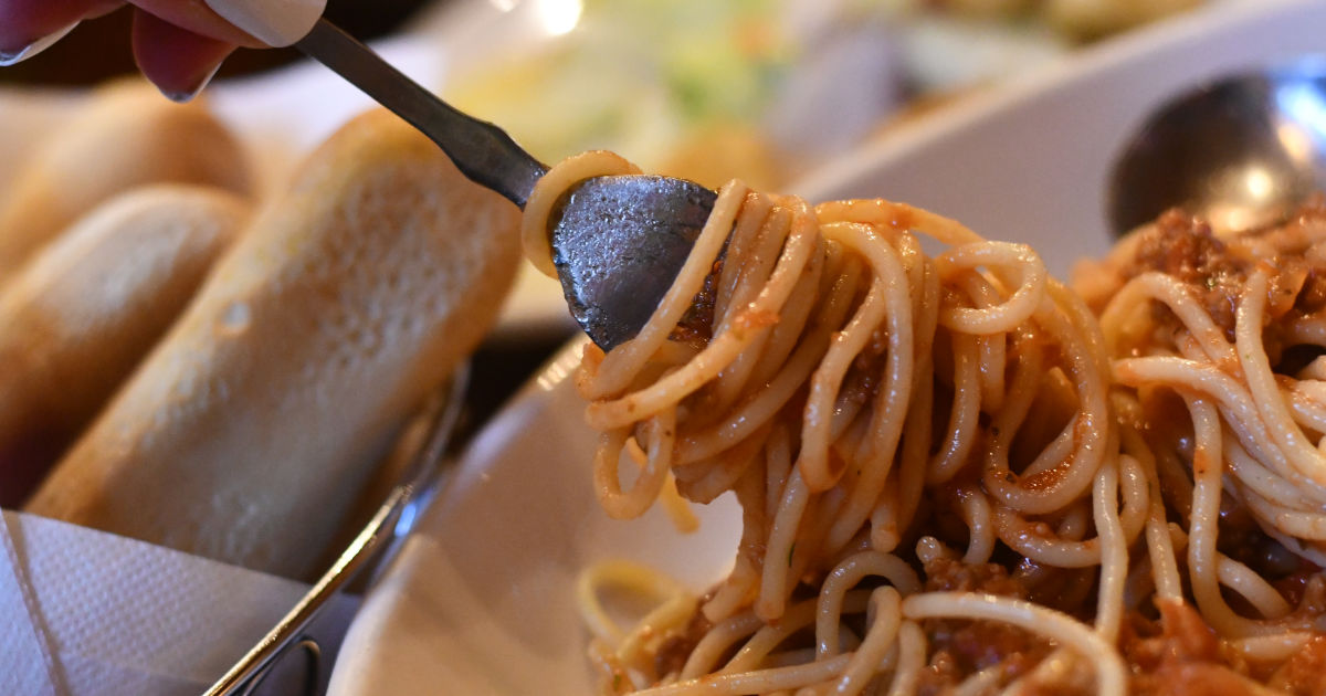 spaghetti with red sauce on fork