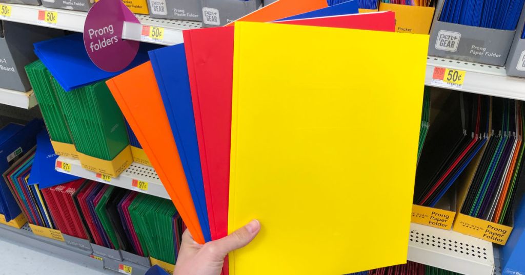 hand holding pen+gear 2 pocket folders