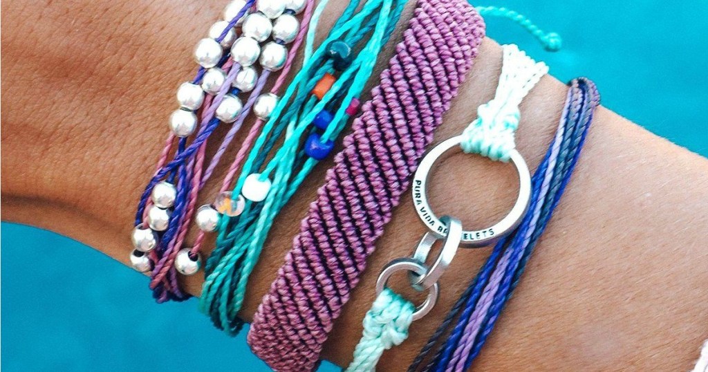 arm with assorted pura vida bracelets