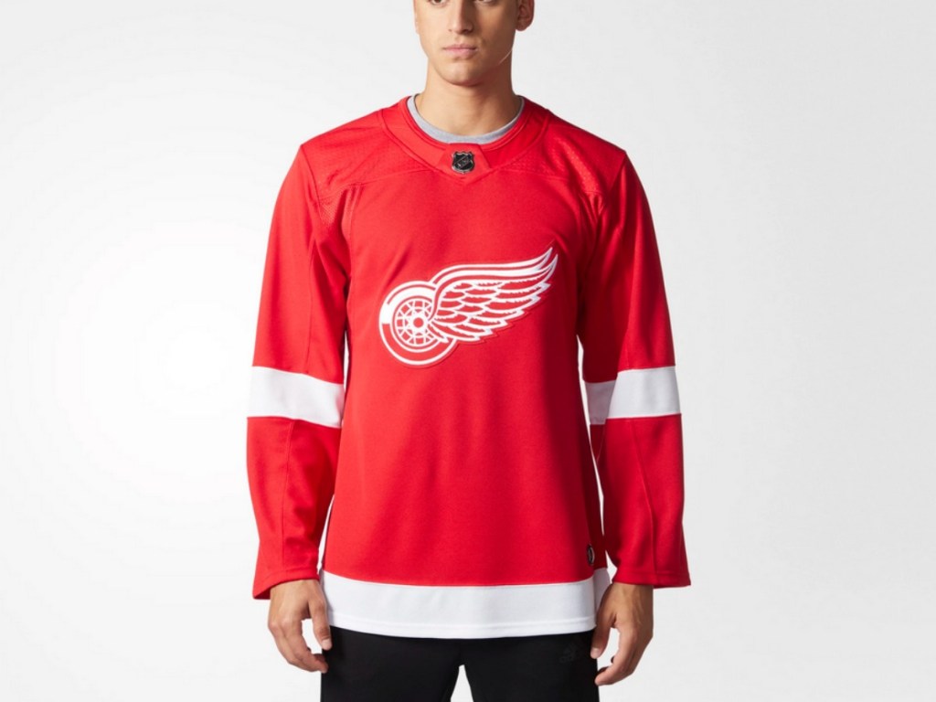 Man wearing adidas Red Wings Jersey