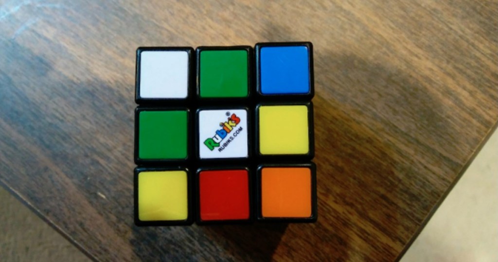 rubik's cube sitting on table