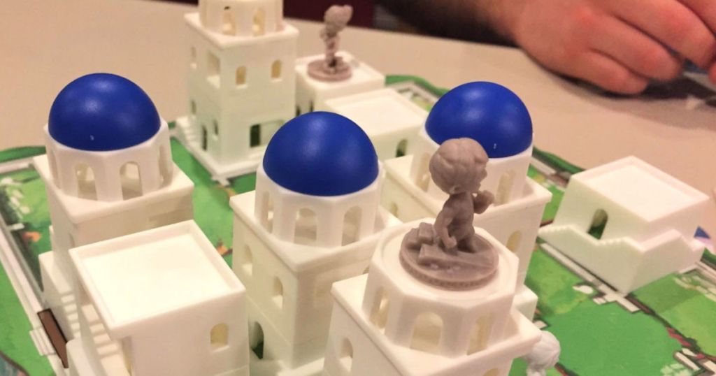 Santorini board game with house pieces