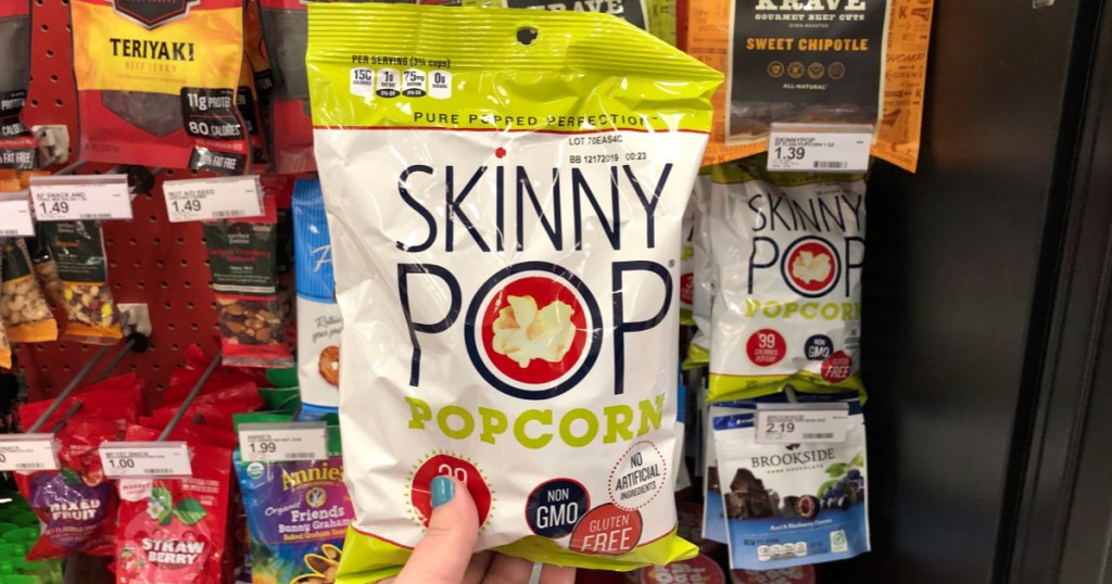 hand holding skinny pop popcorn at target