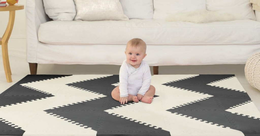 SkipHop brand floor mat in black and white zig zag in a living room