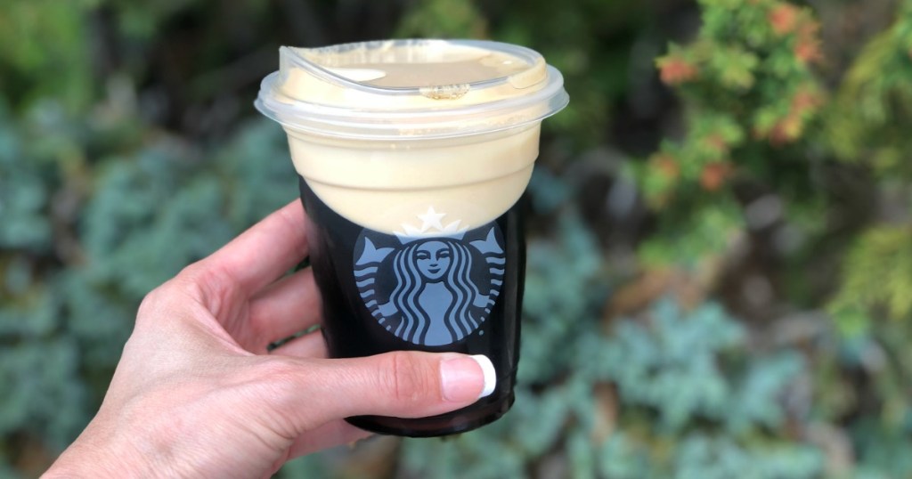 Woman holding Starbucks Nitro Brew Shot