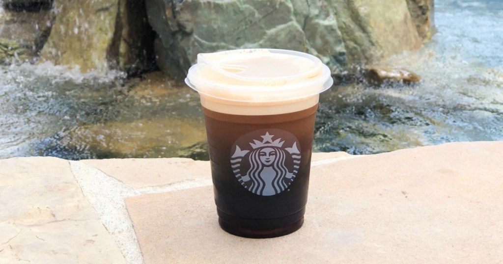 Shot of Nitro at Starbucks with rocks and water in backround