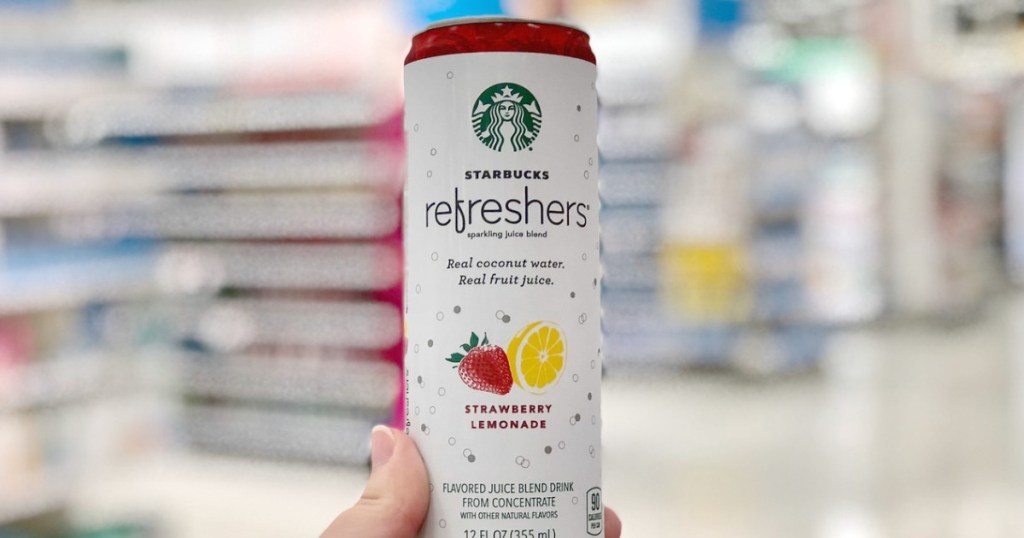 woman holding Starbucks Refreshers Strawberry Lemonade can