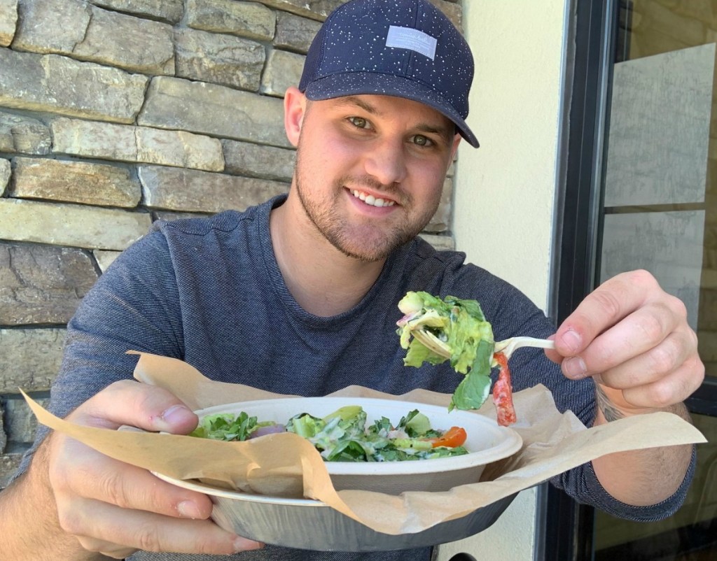 Stetson eating a KETO Salad at Qdoba with chicken, ranch, and guacamole
