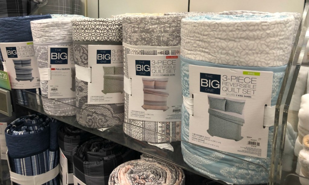 A store display of three piece quilt sets at Kohl's