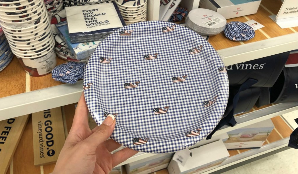 hand holding whale plates in store