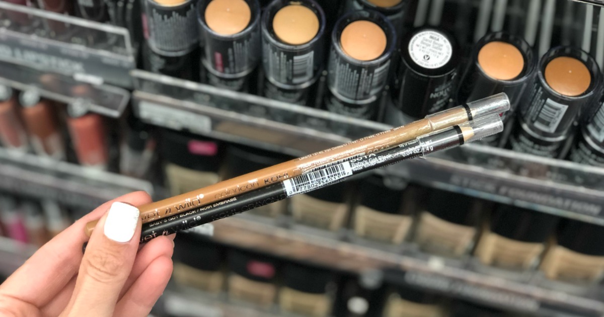 hand holding two wet n wild eyeliners