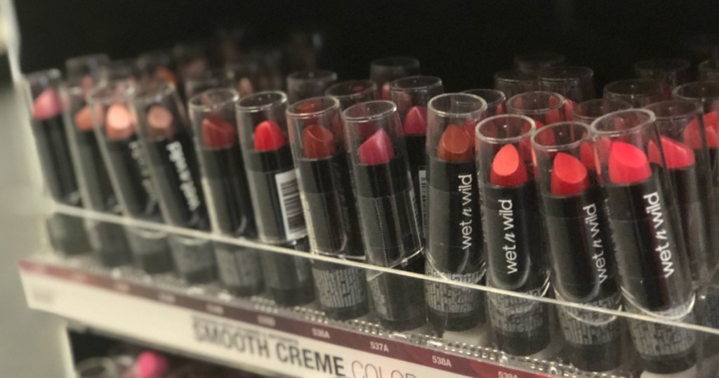 shelf full of lipsticks in many hues