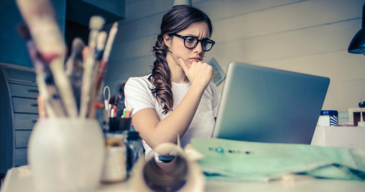 girl looking frustrated at computer