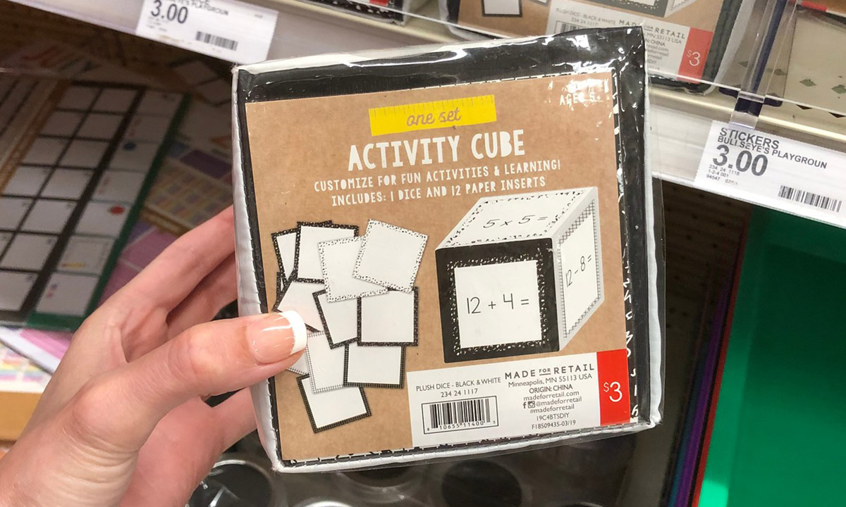 activity cube being held in hand at a target store