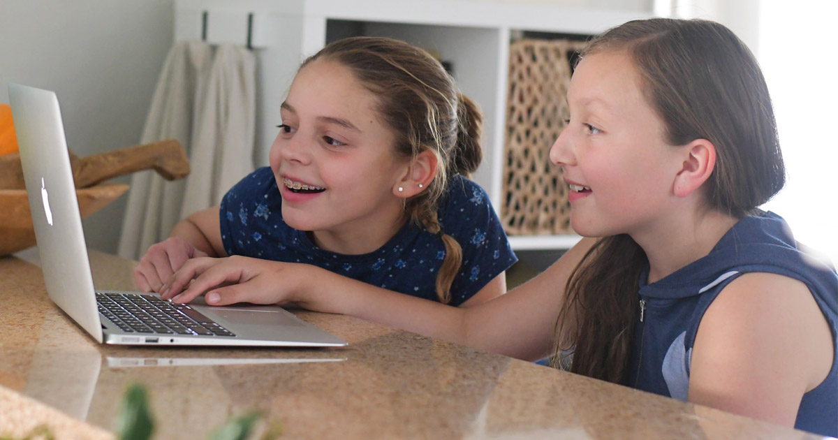 two young girls playing adventure academy
