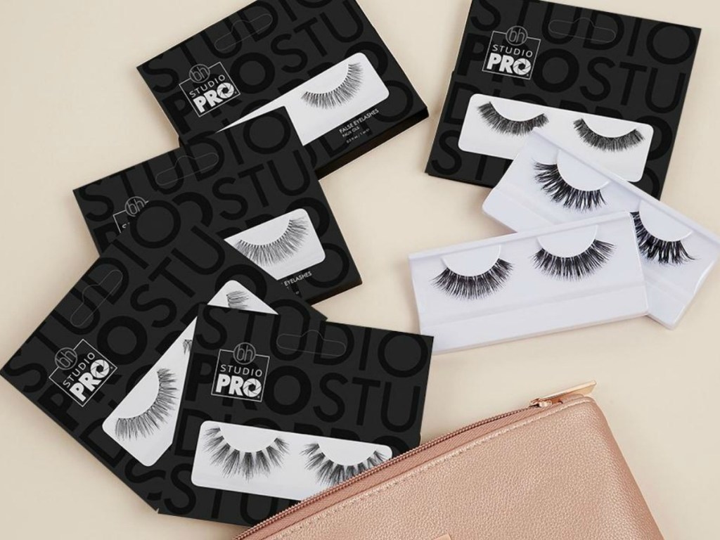 purse with packages of false lashes in packages