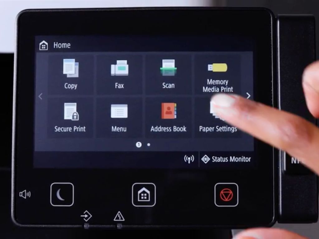 finger touching canon laser printer touch screen