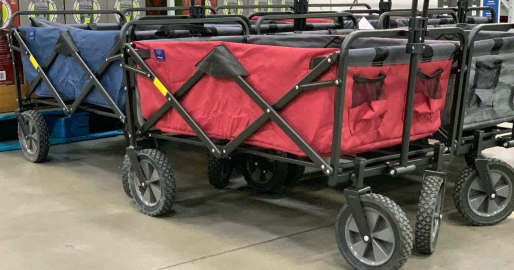 red and blue wagon with big wheels in a store