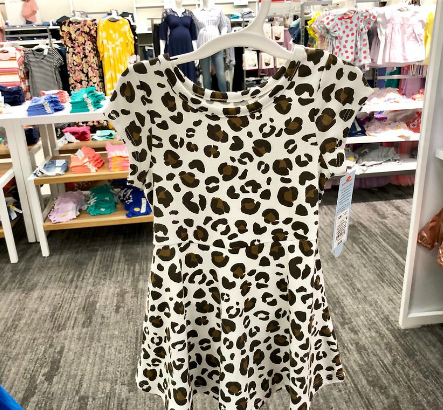 leopard dress hanging up in store