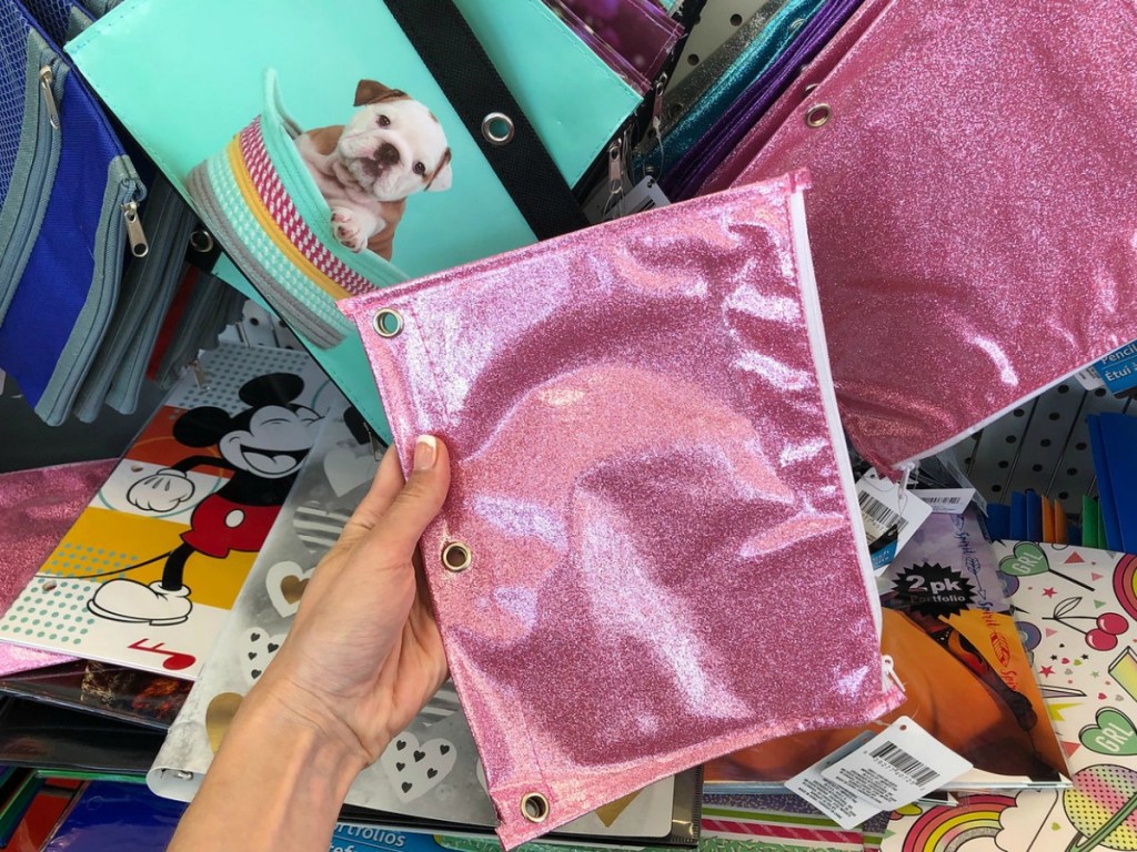 hand holding pink glittery pencil pouch in store