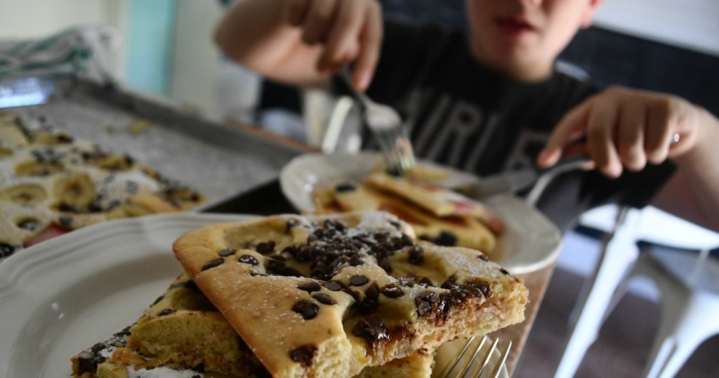Kid eating sheet pan pancakes