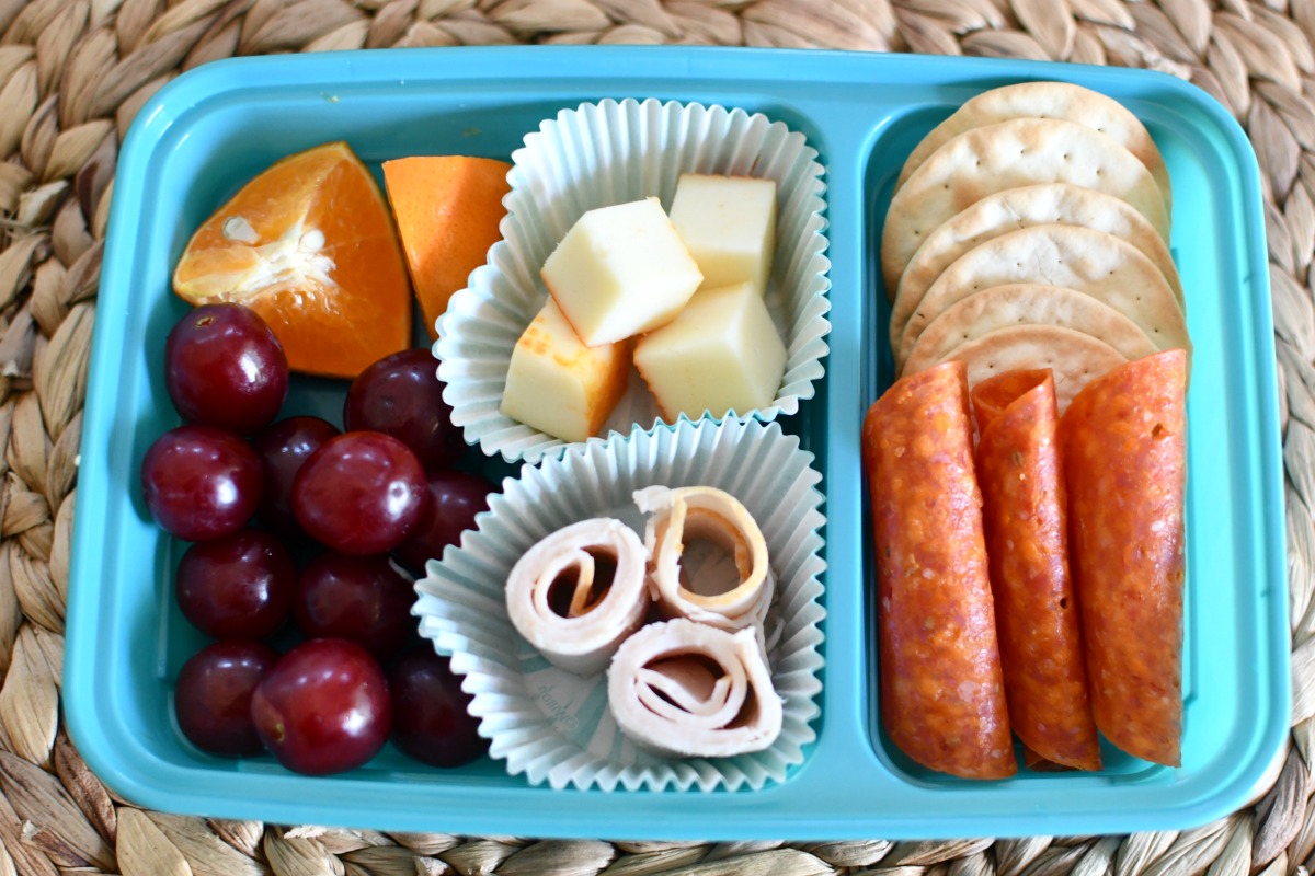 DIY lunchable with crackers in a lunch container 